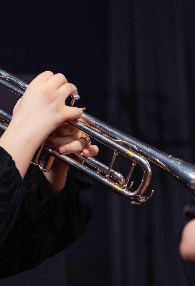 Student holding a trumpet